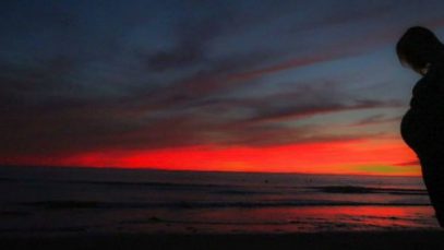 pregnant woman silhouette sunset